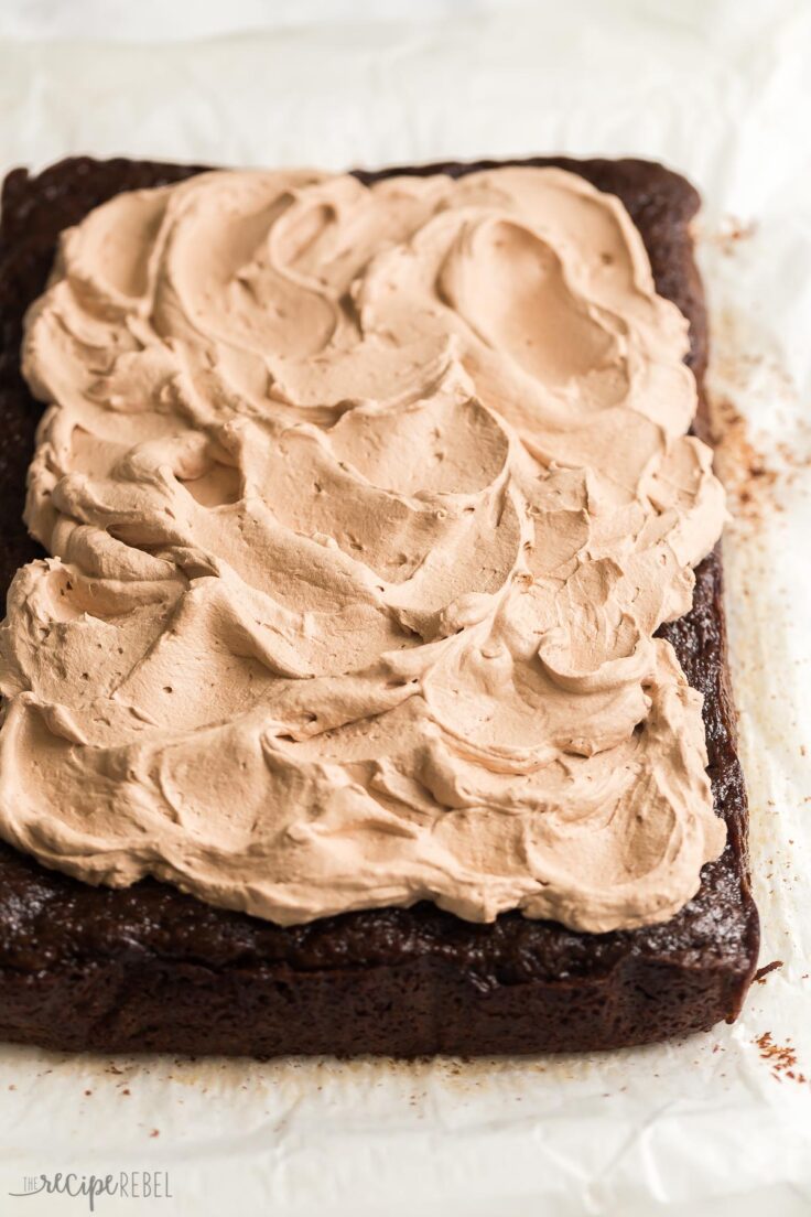 This is the BEST Chocolate Zucchini Cake! Perfectly moist, rich and fudgy and loaded with zucchini (but you'd never know)! Topped with chocolate whipped cream. #chocolate #dessert | zucchini cake | zucchini recipes | chocolate cake | best chocolate cake whole chocolate zucchini cake with chocolate whipped cream