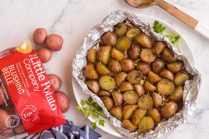 overhead image of grilled potatoes with bag of Little potatoes