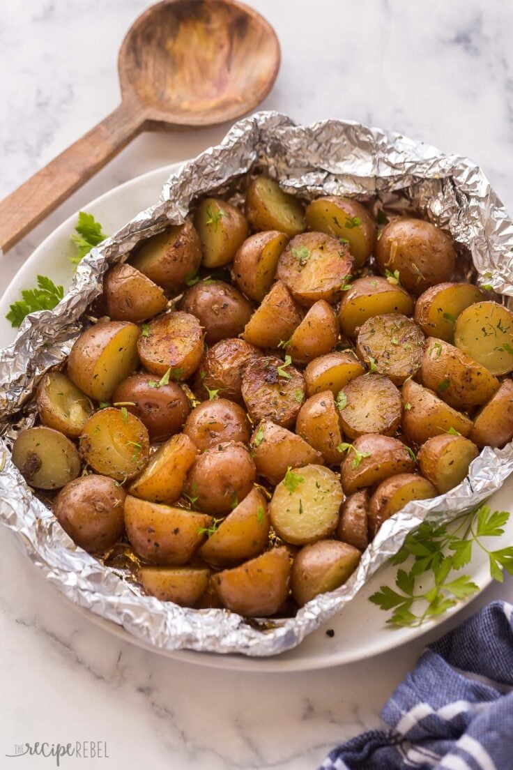 close up image of little potatoes grilled in foil