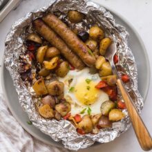 overhead image of breakfast foil pack on plate with fork