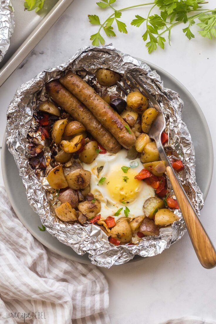 overhead image of breakfast foil pack on plate with fork