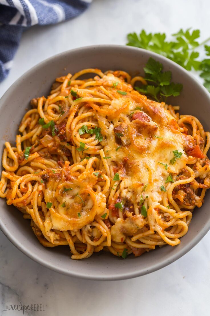 close up image of baked spaghetti in bowl