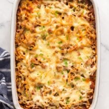 square image of baked spaghetti in baking dish