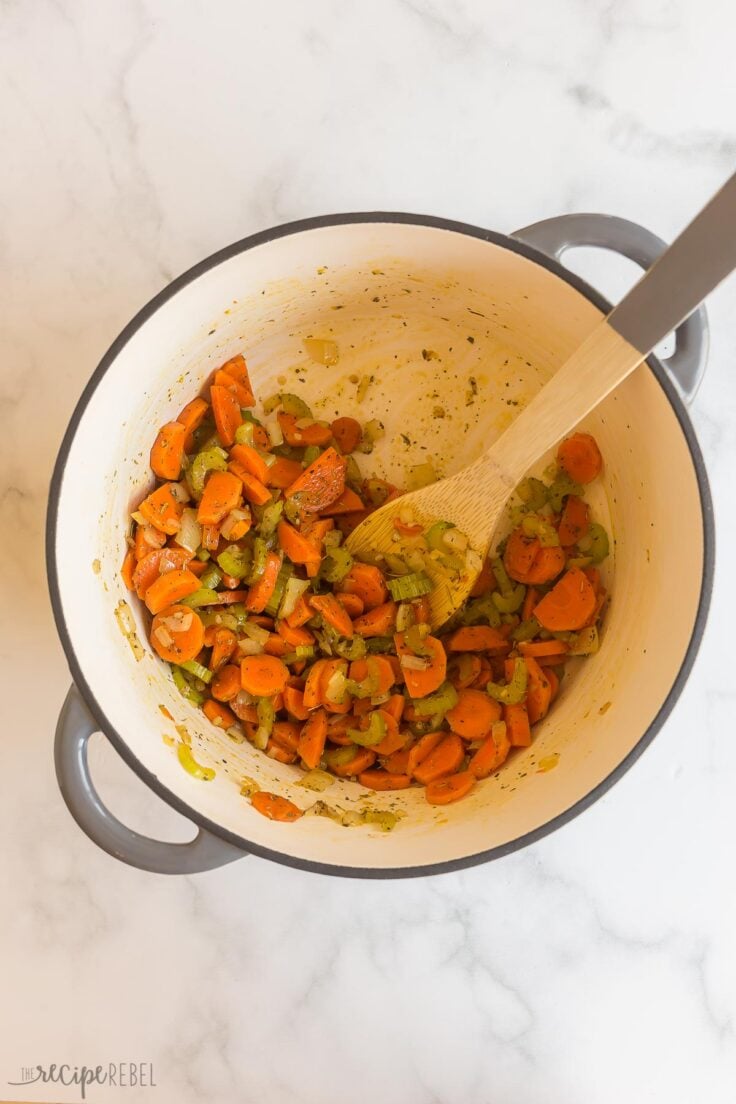 cooked vegetables in pot with spices added