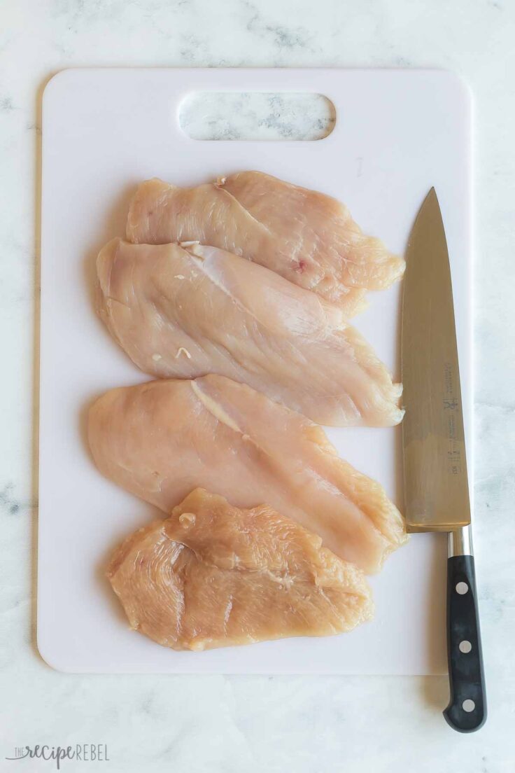 slicing chicken breasts to form four thin pieces