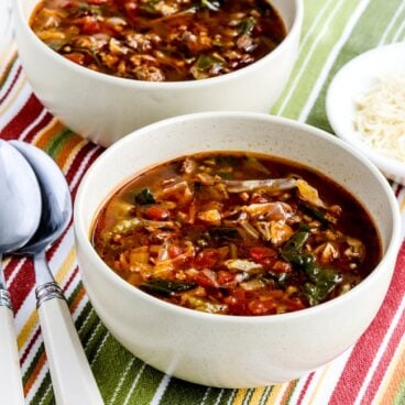 two bowls of cabbage soup with ground beef
