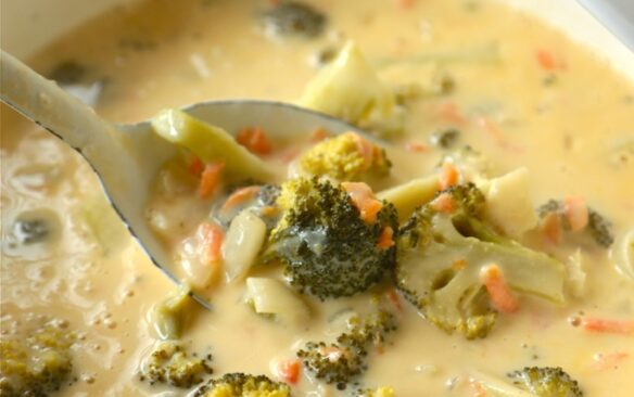 close up image of bowl of broccoli cheese soup