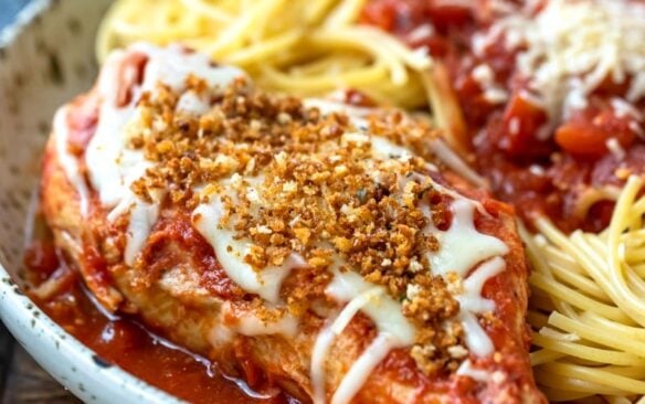 slow cooker chicken parmesan with pasta on a plate