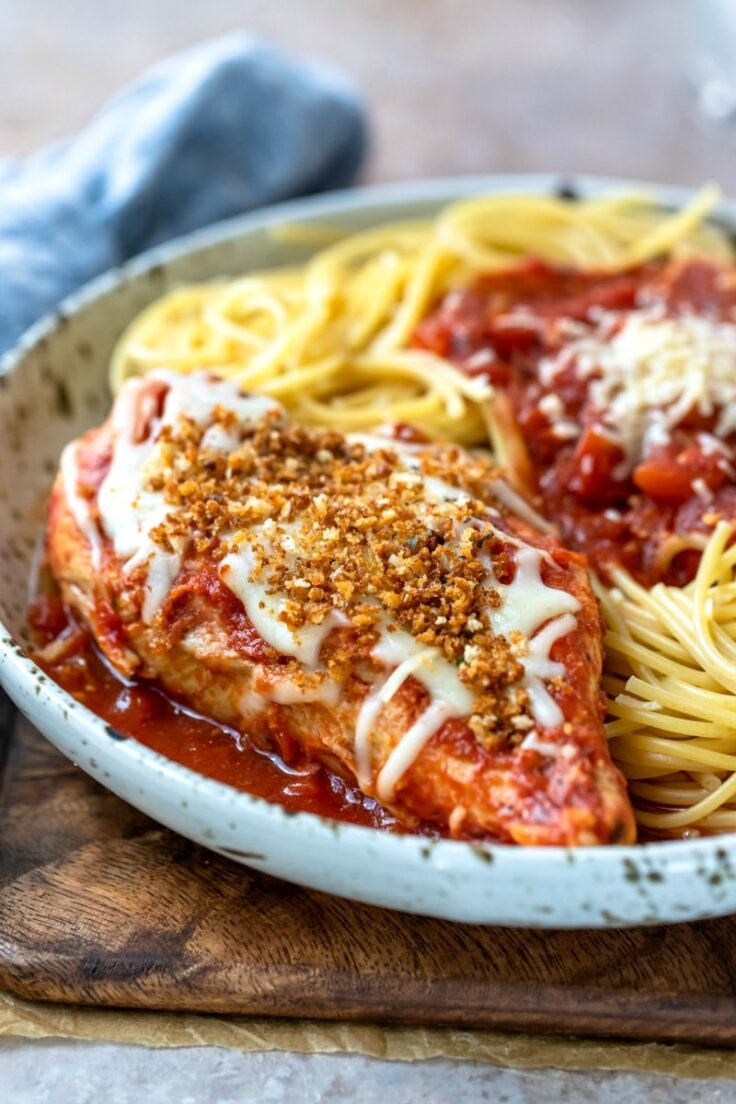 slow cooker chicken parmesan with pasta on a plate