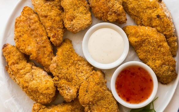 square image of overhead platter of air fryer fried chicken