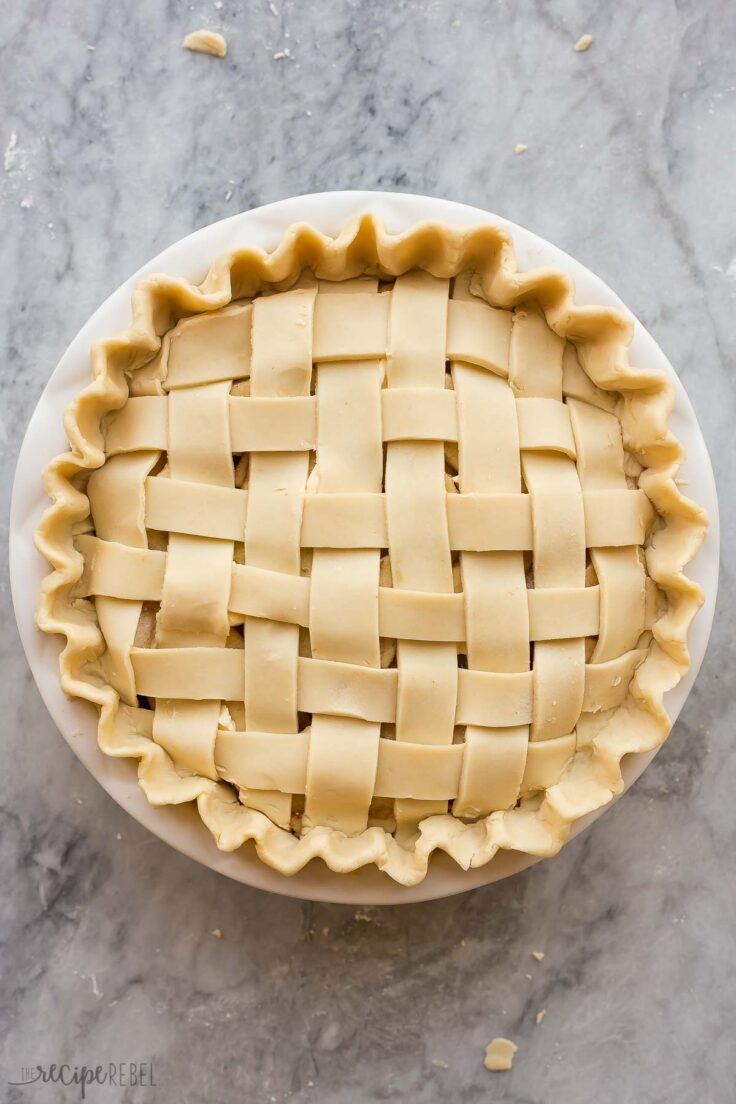 uncooked apple pie with lattice crust ready to bake