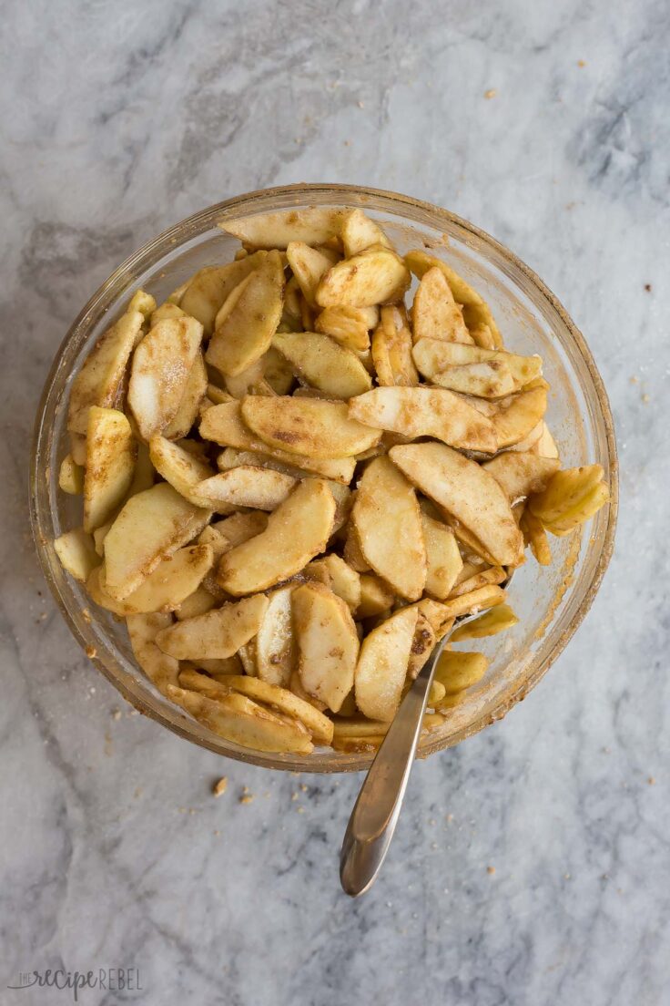 seasoned apples in bowl ready to add to pie