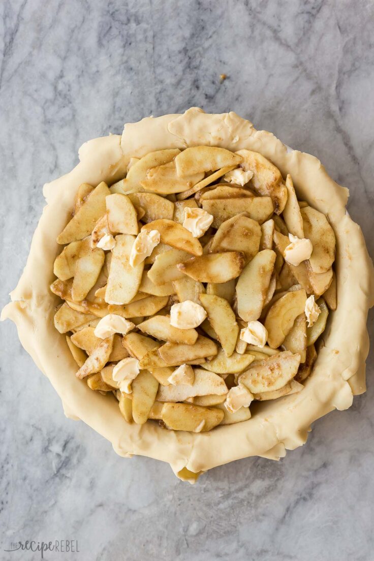 apples in bottom pie crust dotted with butter