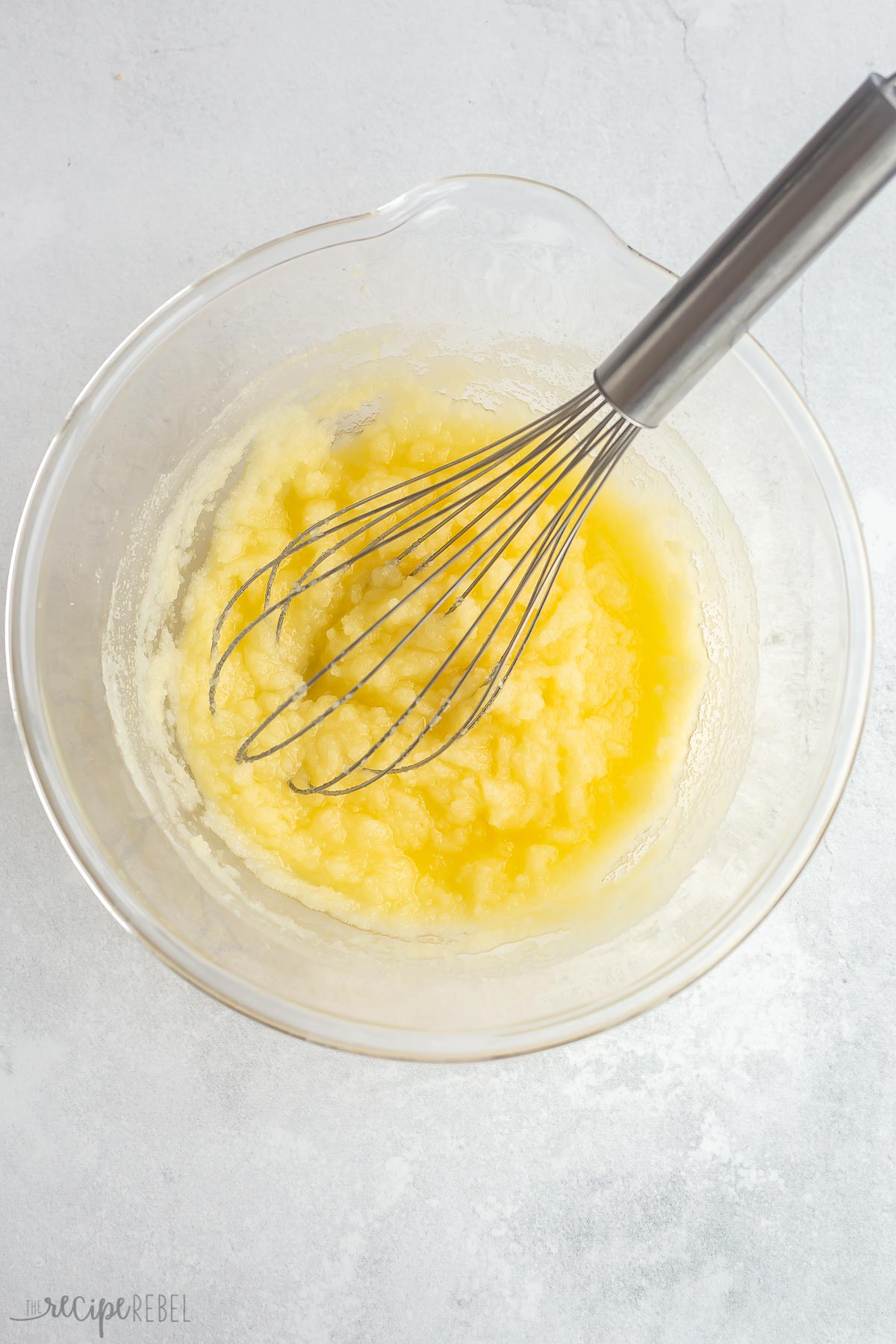 sugar and melted butter whisked together in glass bowl.