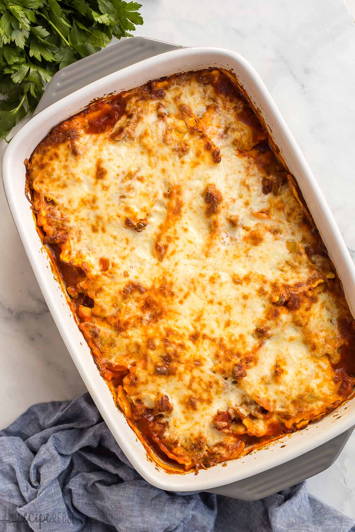 overhead image of pan of baked ravioli with cheese