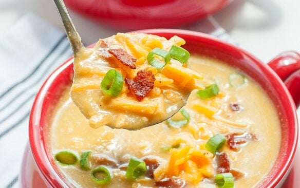 slow cooker cauliflower and sweet potato soup in red bowl