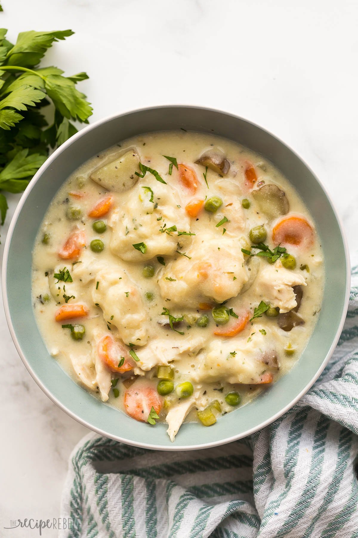 overhead image of crockpot chicken and dumplings in a bowl