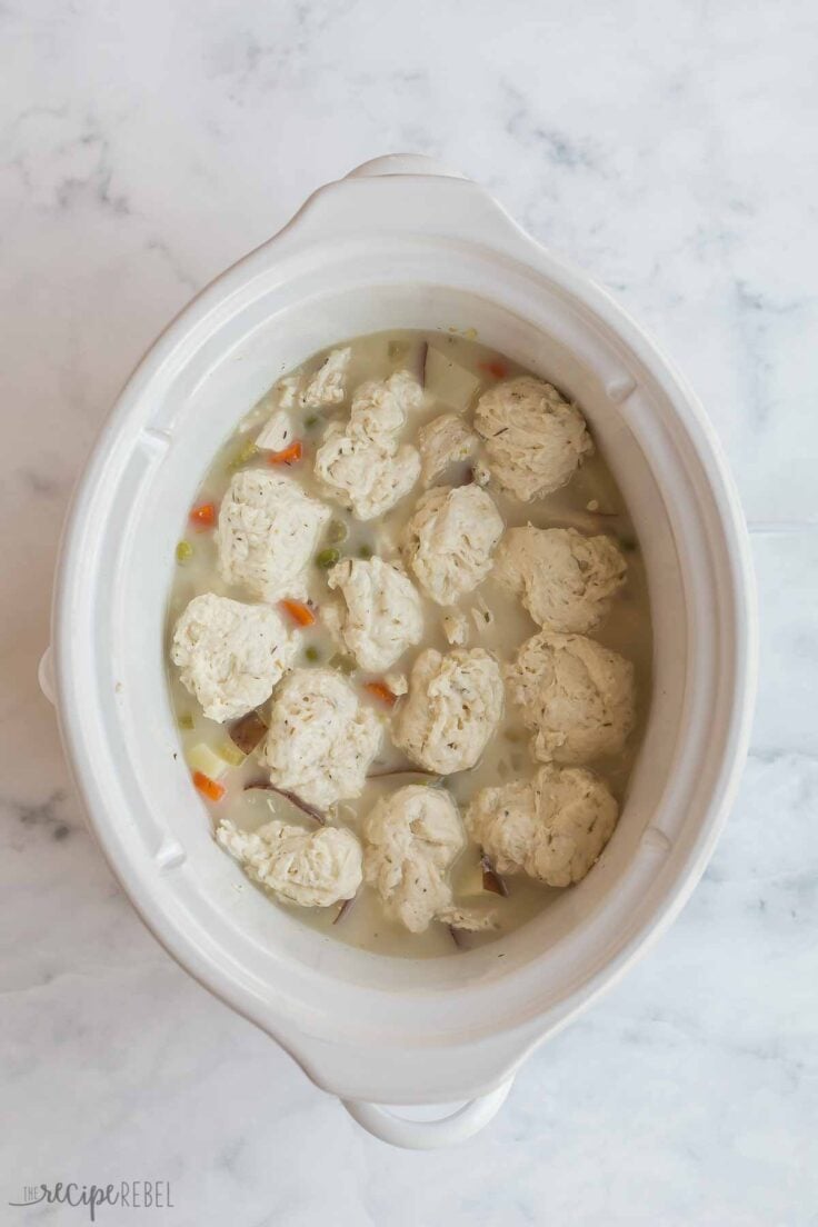 uncooked dumplings in crockpot with filling