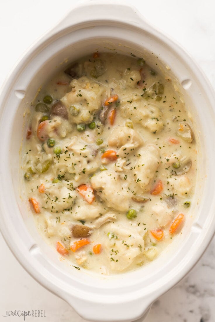overhead image of chicken and dumplings in crockpot after cooking