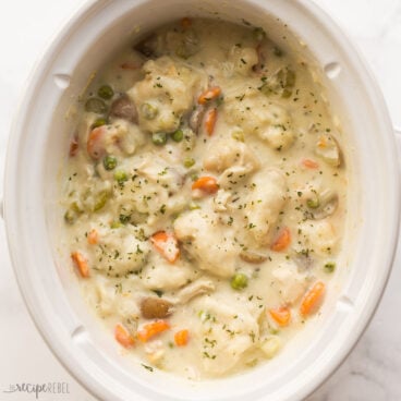 square image of crockpot chicken and dumplings in slow cooker