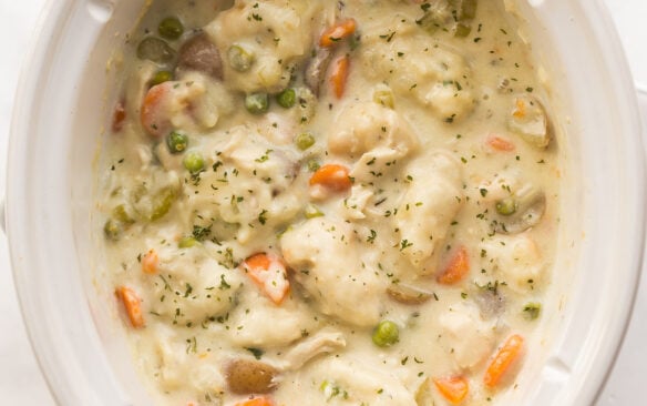 square image of crockpot chicken and dumplings in slow cooker