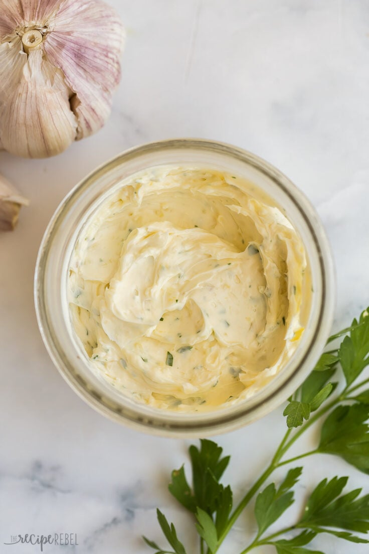 overhead image of garlic butter in a small jar