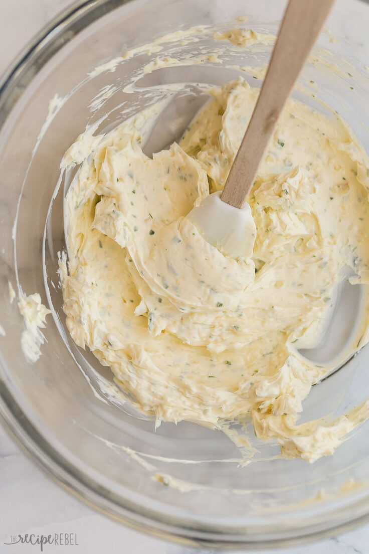 prepared garlic butter in glass bowl with spatula