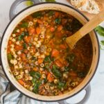 overhead square image of italian sausage soup in pot