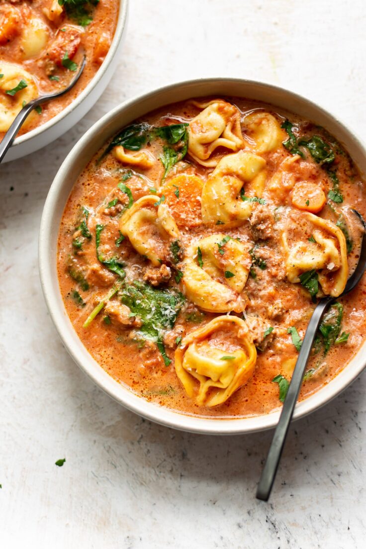overhead image of bowl of slow cooker tortellini soup
