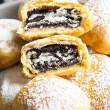 close up image of air fried oreos dusted with powdered sugar