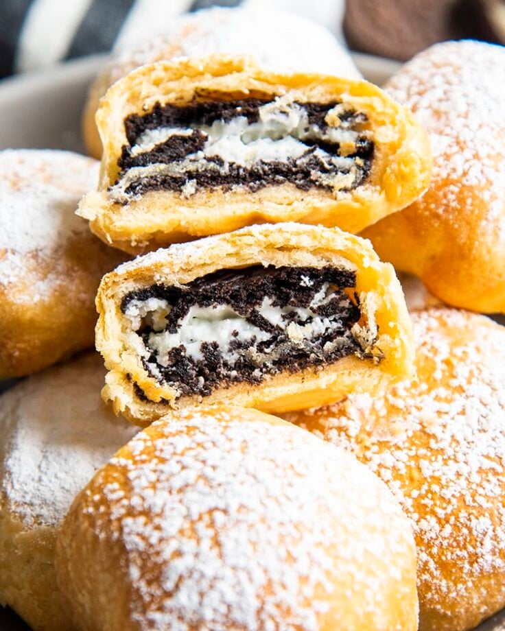 close up image of air fried oreos dusted with powdered sugar