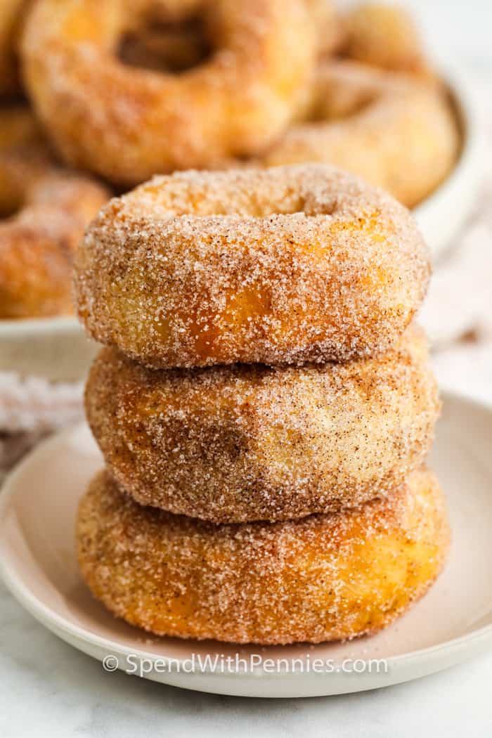 stack of three air fryer donuts coated in cinnamon sugar