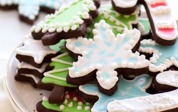 chocolate cut out cookies decorated with colorful icing