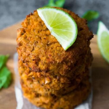 make ahead thai salmon patties stacked with lime slice on top