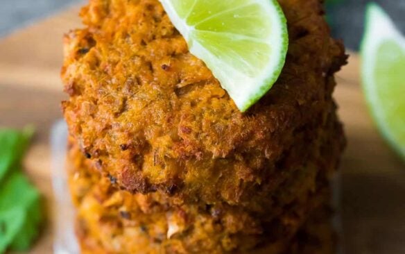 make ahead thai salmon patties stacked with lime slice on top