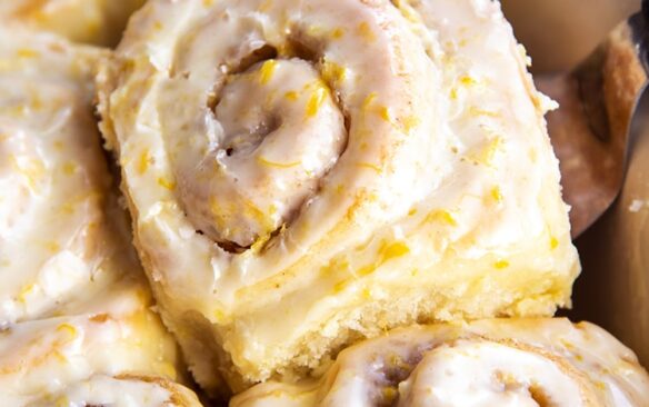 close up image of orange rolls with glaze