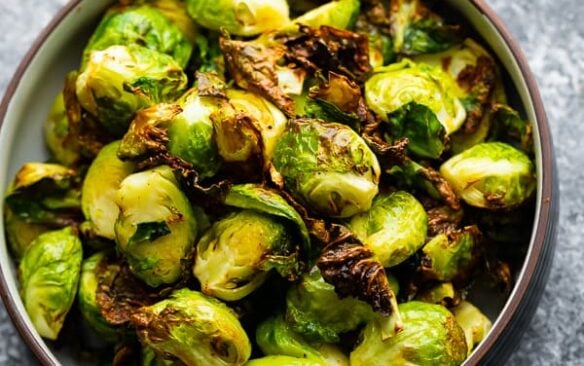 overhead image of air fryer brussels sprouts in bowl