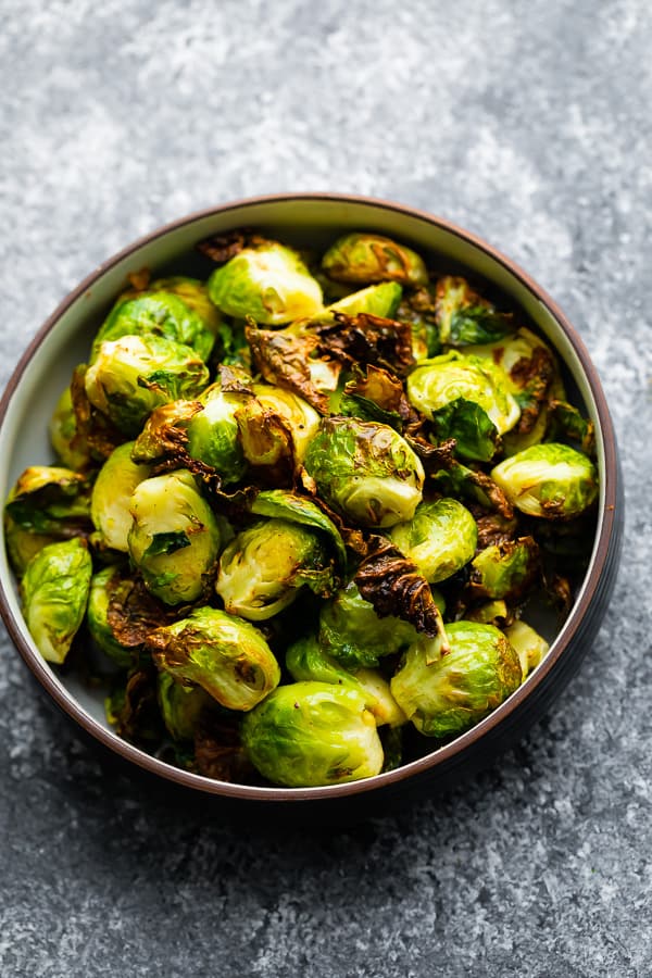 overhead image of air fryer brussels sprouts in bowl