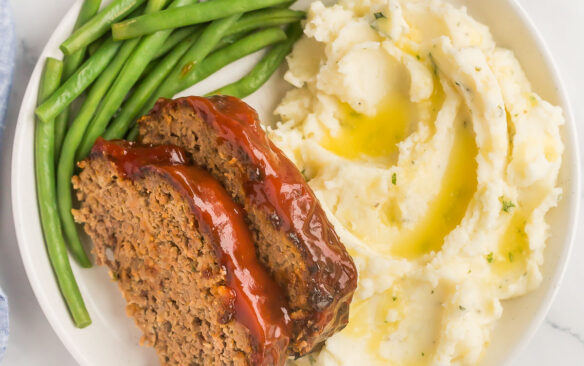 square image of air fryer meatloaf with mashed potatoes and green beans