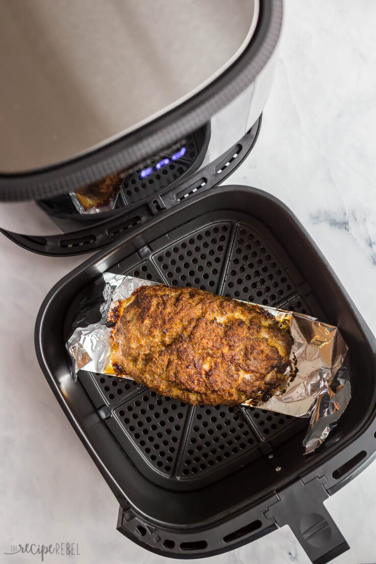 browned air fryer meatloaf in air fryer basket