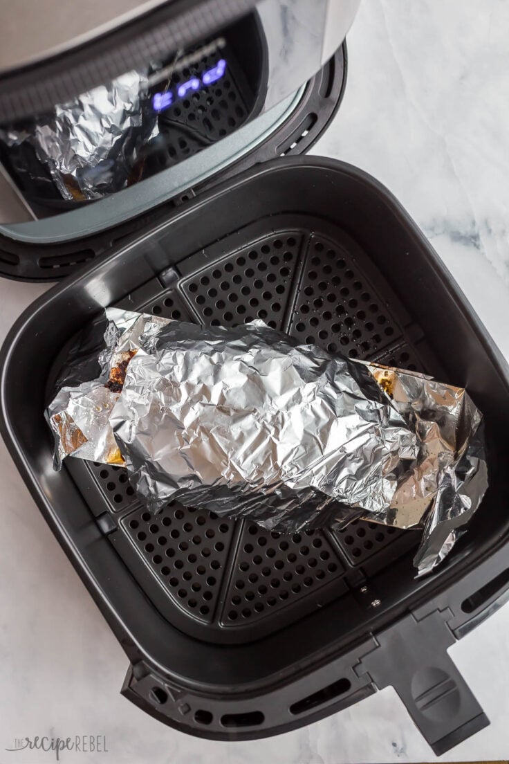 air fryer meatloaf covered with a piece of tin foil on top