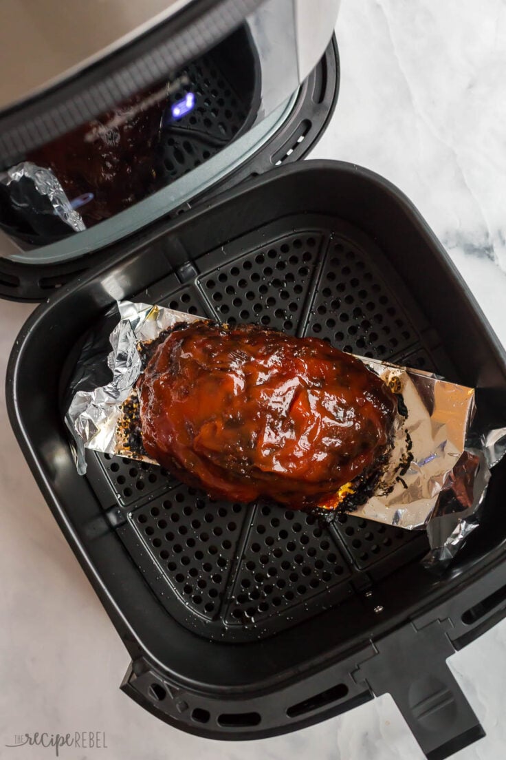 air fryer meatloaf in air fryer with glaze on top