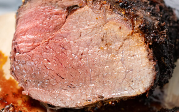 air fryer roast beef cut open to reveal slightly pink center