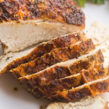 air fryer turkey breast with several slices cut