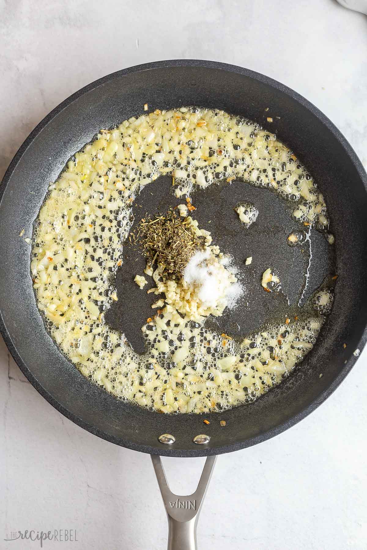 garlic herbs and spices in a skillet.