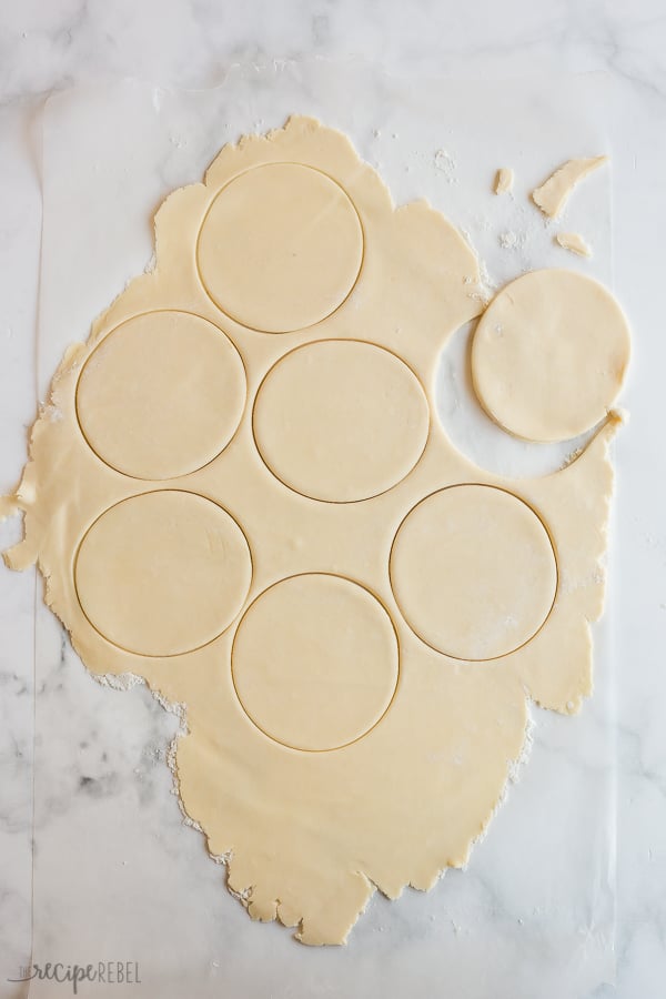 pastry being cut into circles to make tart shells