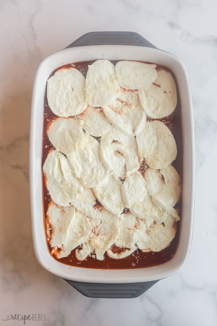 cheese cannelloni with fresh mozzarella on top ready to bake