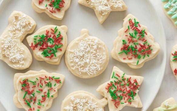 overhead image of christmas sugar cookies with white and red and green sprinkles