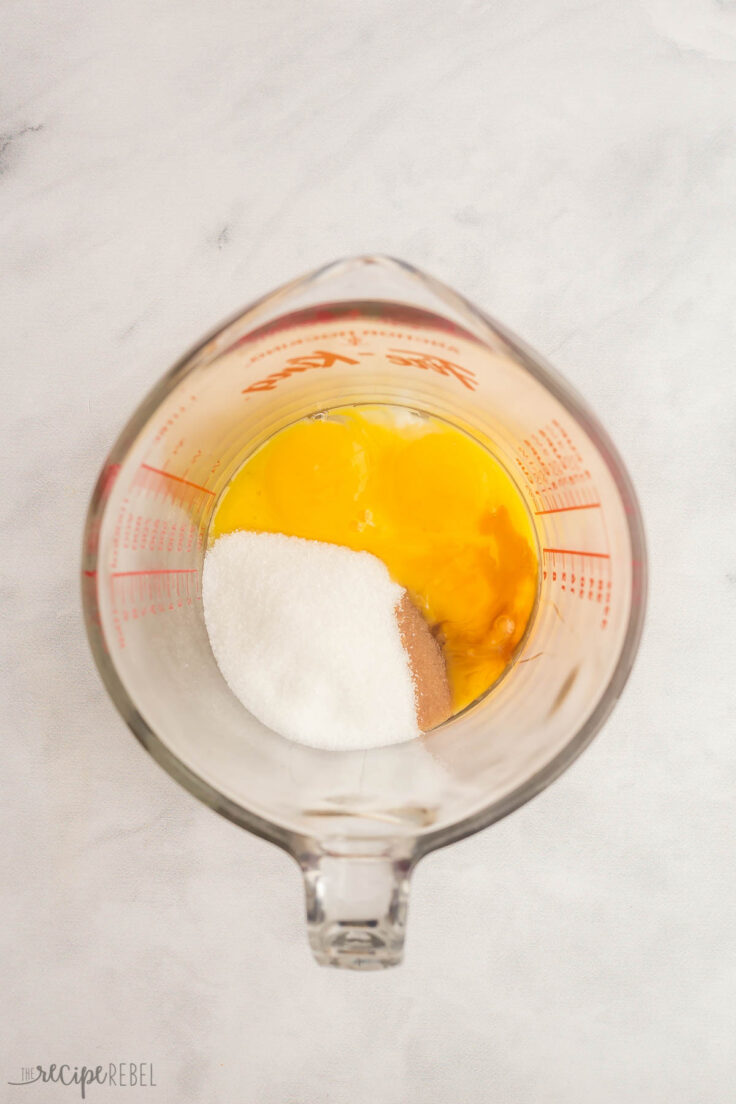 eggs sugar and vanilla in a large glass measuring cup