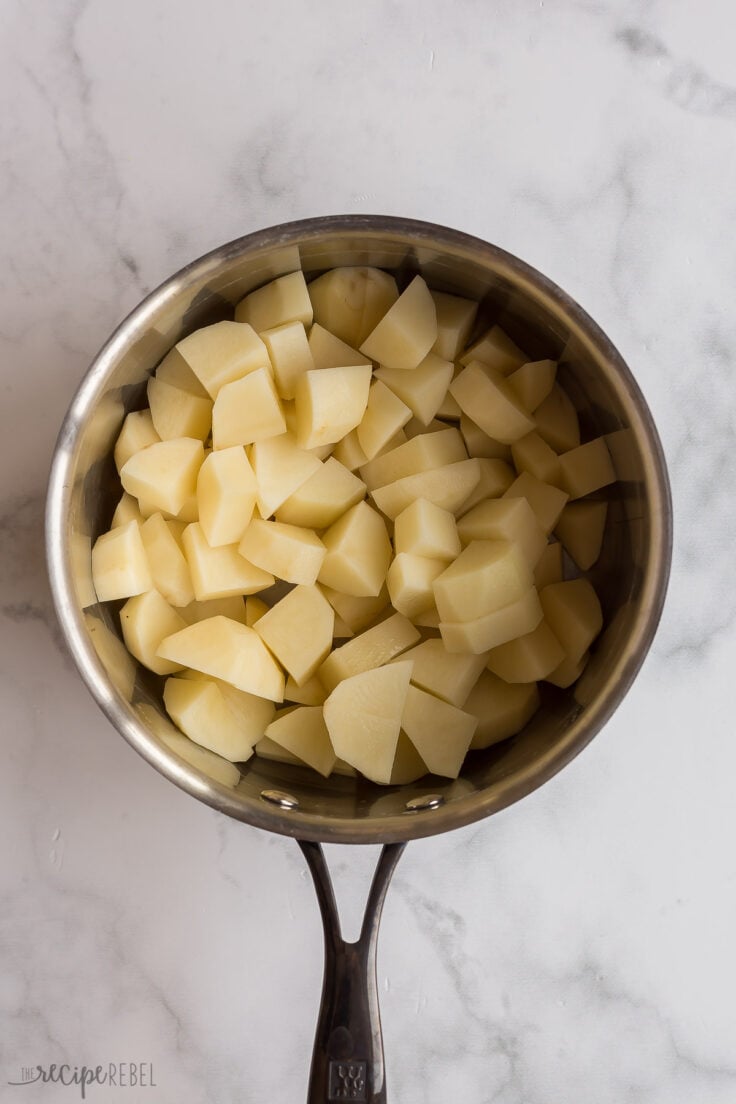 uncooked potatoes cut and in pot